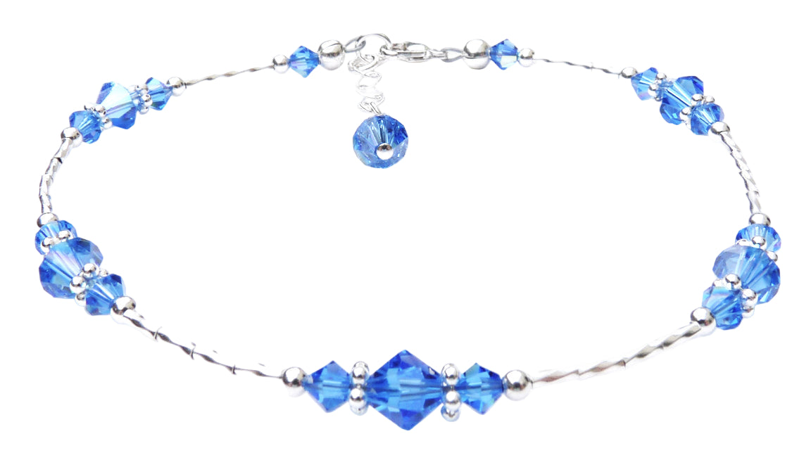 Handmade medium sapphire blue September birthstone anklet in 925 sterling silver with liquid silver beads and extender.
