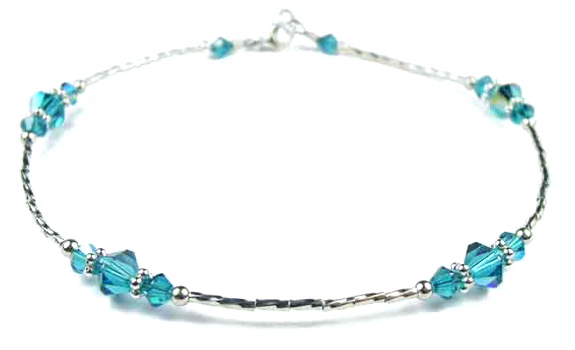 Handmade Blue Zircon December birthstone anklet in 925 sterling silver with liquid silver beads and 1 inch extender.